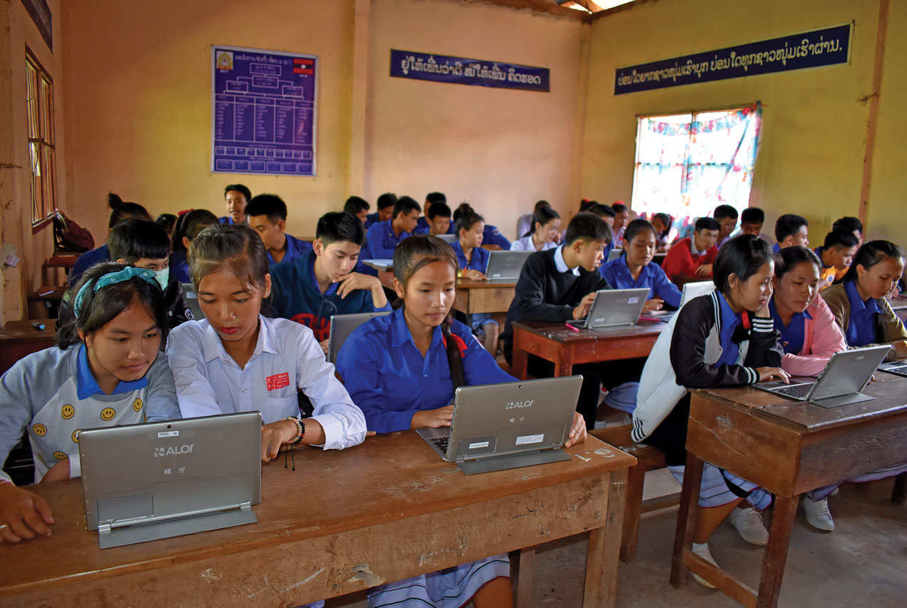 Class of students with laptop in a Laos school